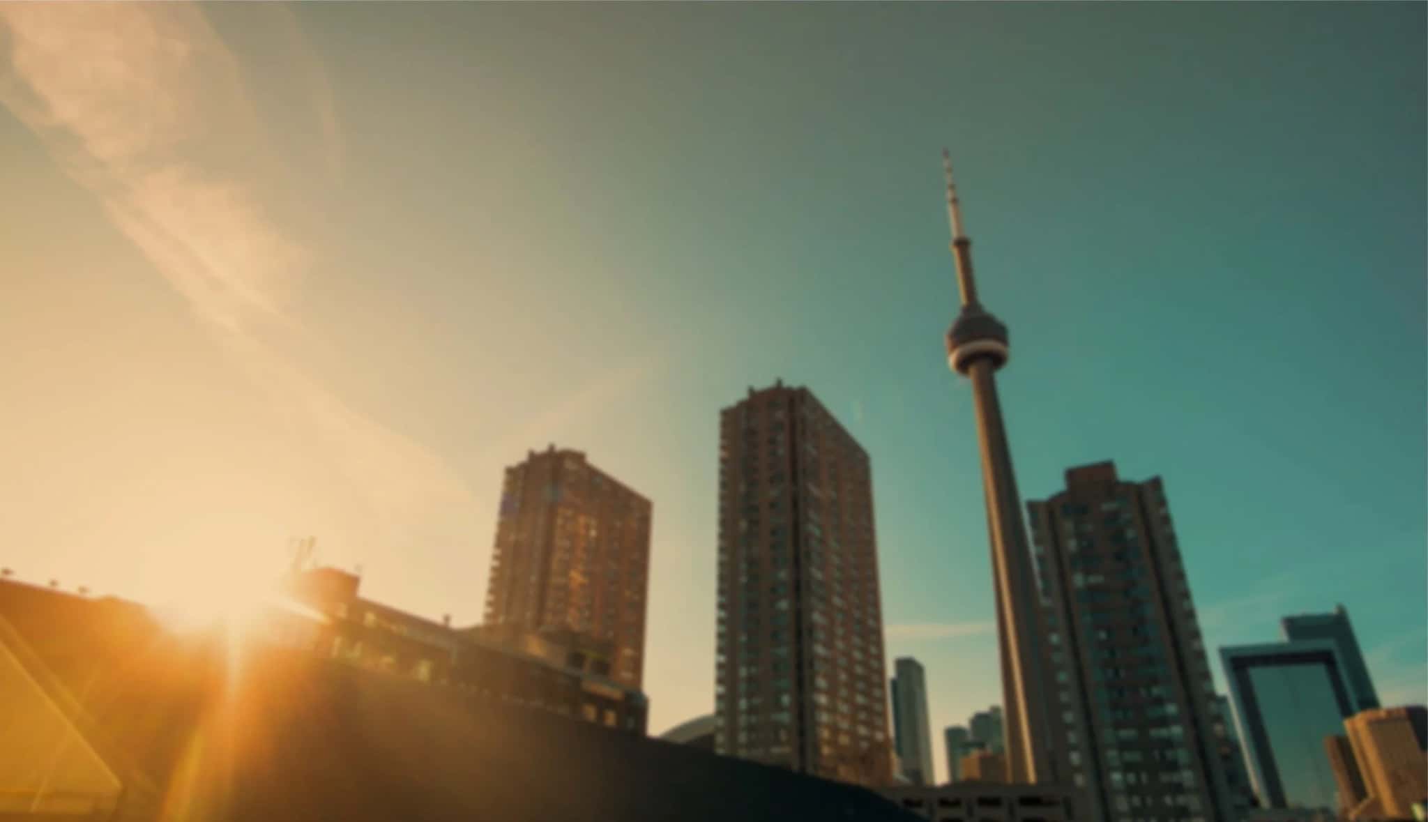 Downtown Toronto and the CN Tower at sunset, the neighbourhood served by the dentists at Carlton Dental