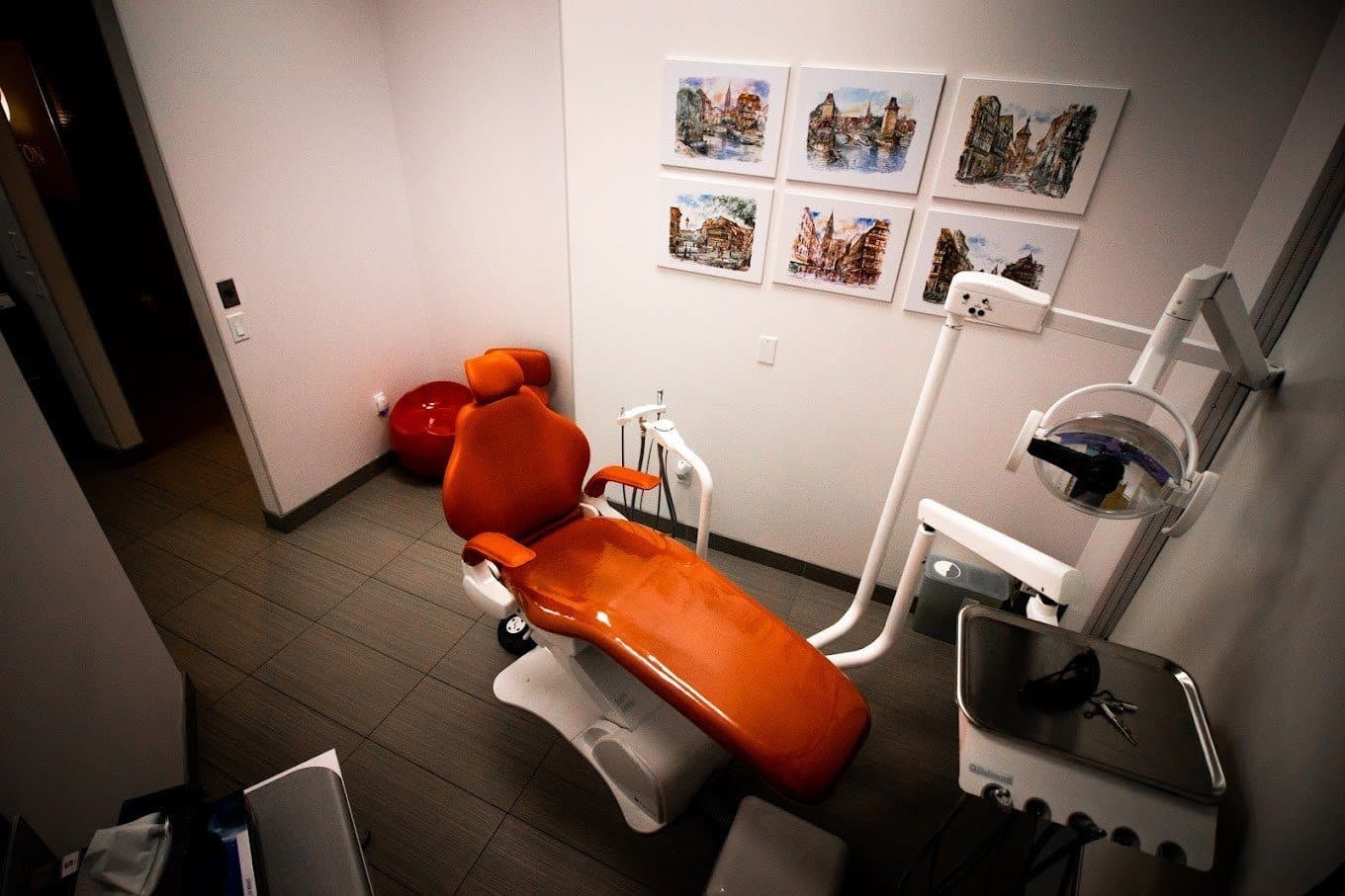 Treatment room with an orange dentist's chair at Carlton Dental, downtown Toronto Treatment room with an orange dentist's chair at Carlton Dental, downtown Toronto